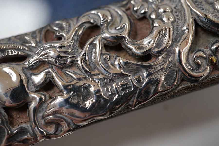 A George V repousse silver mounted rectangular photograph frame, maker's mark rubbed, London, 1911, 18.3cm.